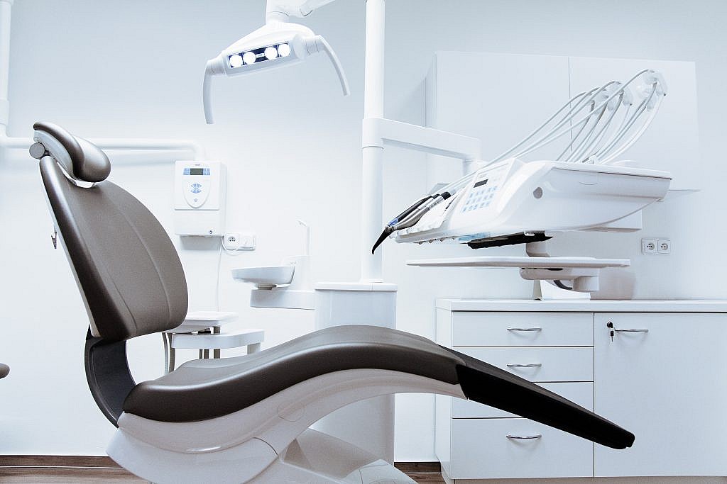 white dental chair in office