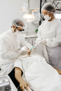 A dentist applying a dental crown