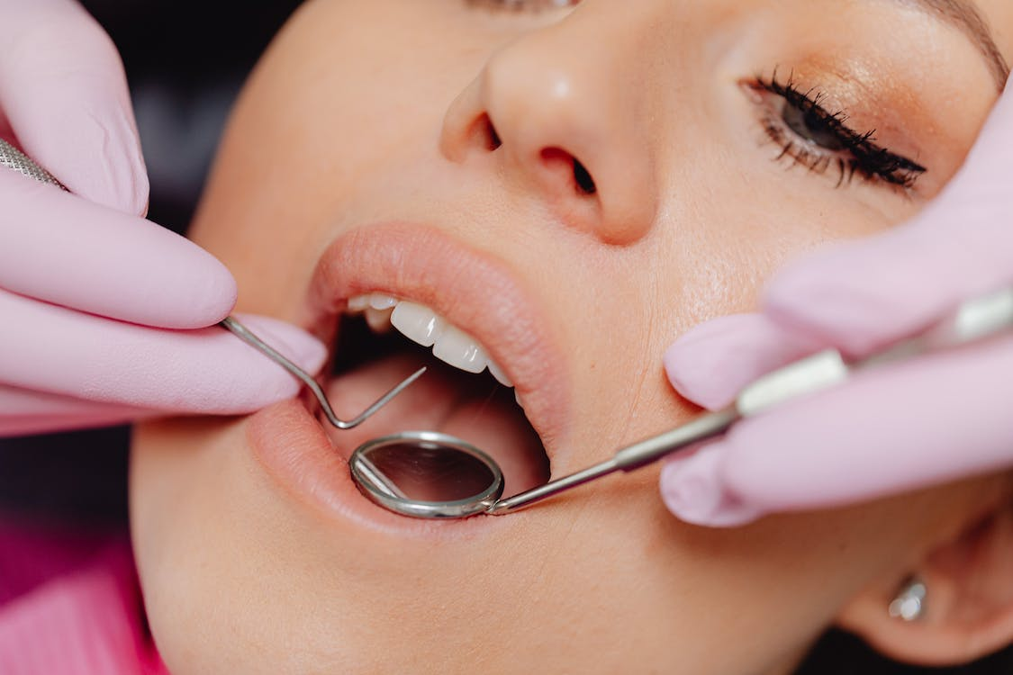 a woman getting a dental checkup